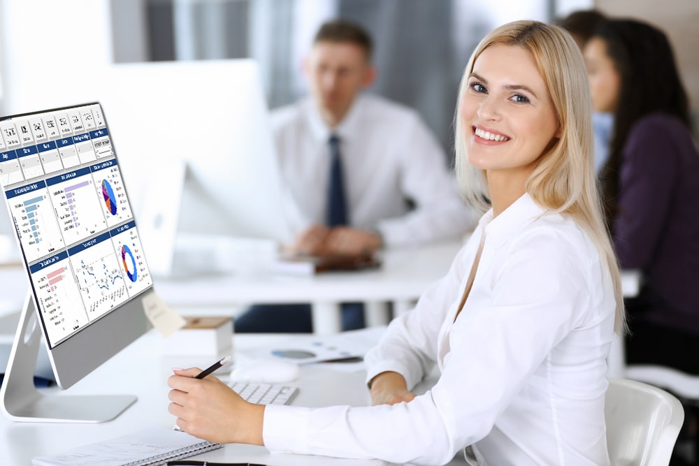 Business,Woman,Using,Computer,At,Workplace,In,Modern,Office.,Secretary